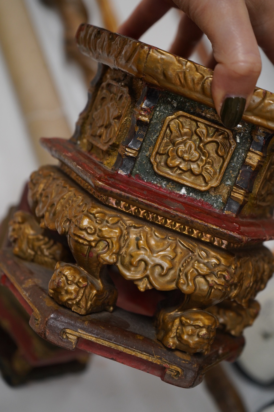 Five Chinese lacquered and partially gilt stands including a hexagonal pair, largest 15cm high. Condition - mostly fair